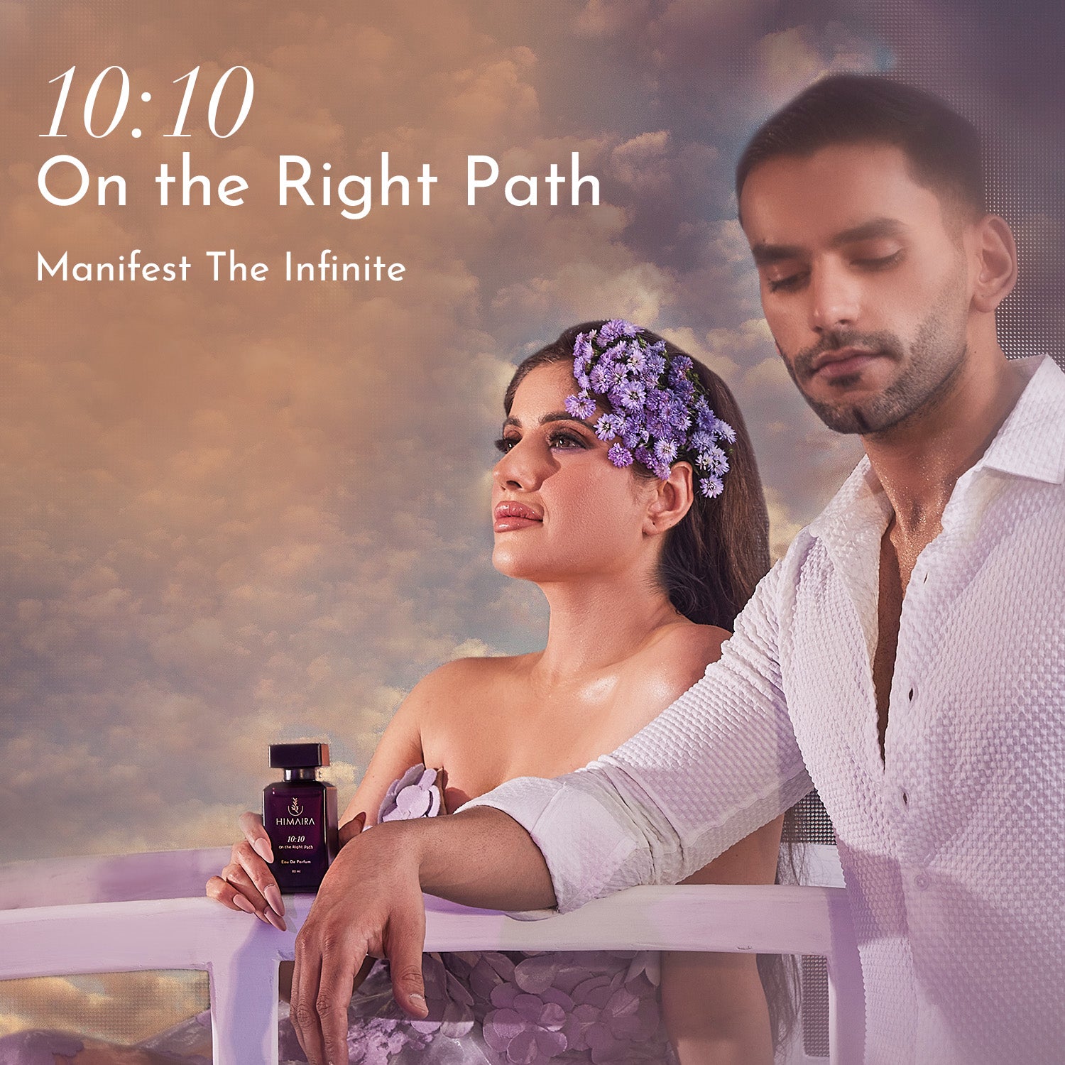 A photo of a couple posing with a bottle of Himaira&