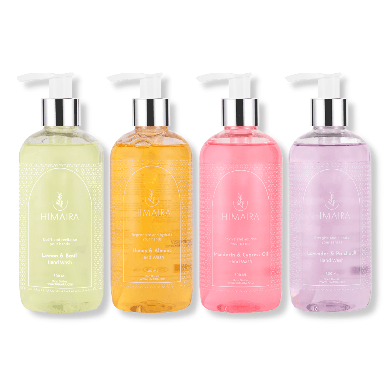 Four hand wash bottle; pink, lavender, tan brown and saffron mango color with pump in each bottle, showcasing wide range of Himaira&
