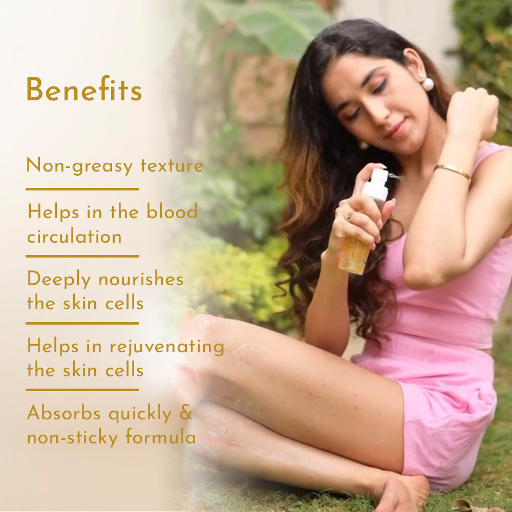 A woman sitting outdoors in a pink dress, spraying Himaira&