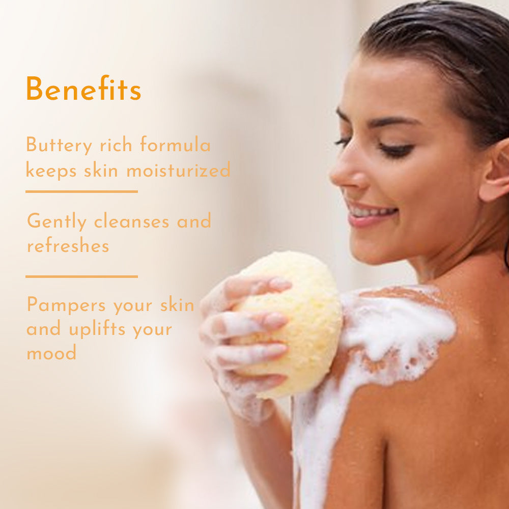 Smiling women lathers shoulder with a foamy bath sponge and on her left text shows Benefits of Mango Body Wash; buttery moisture, gentle cleanse and uplifted mood.